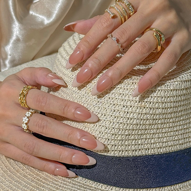 Fincloset handmade press-on nails in almond shape with nude French tip design, elegant and reusable fake nails for everyday wear.