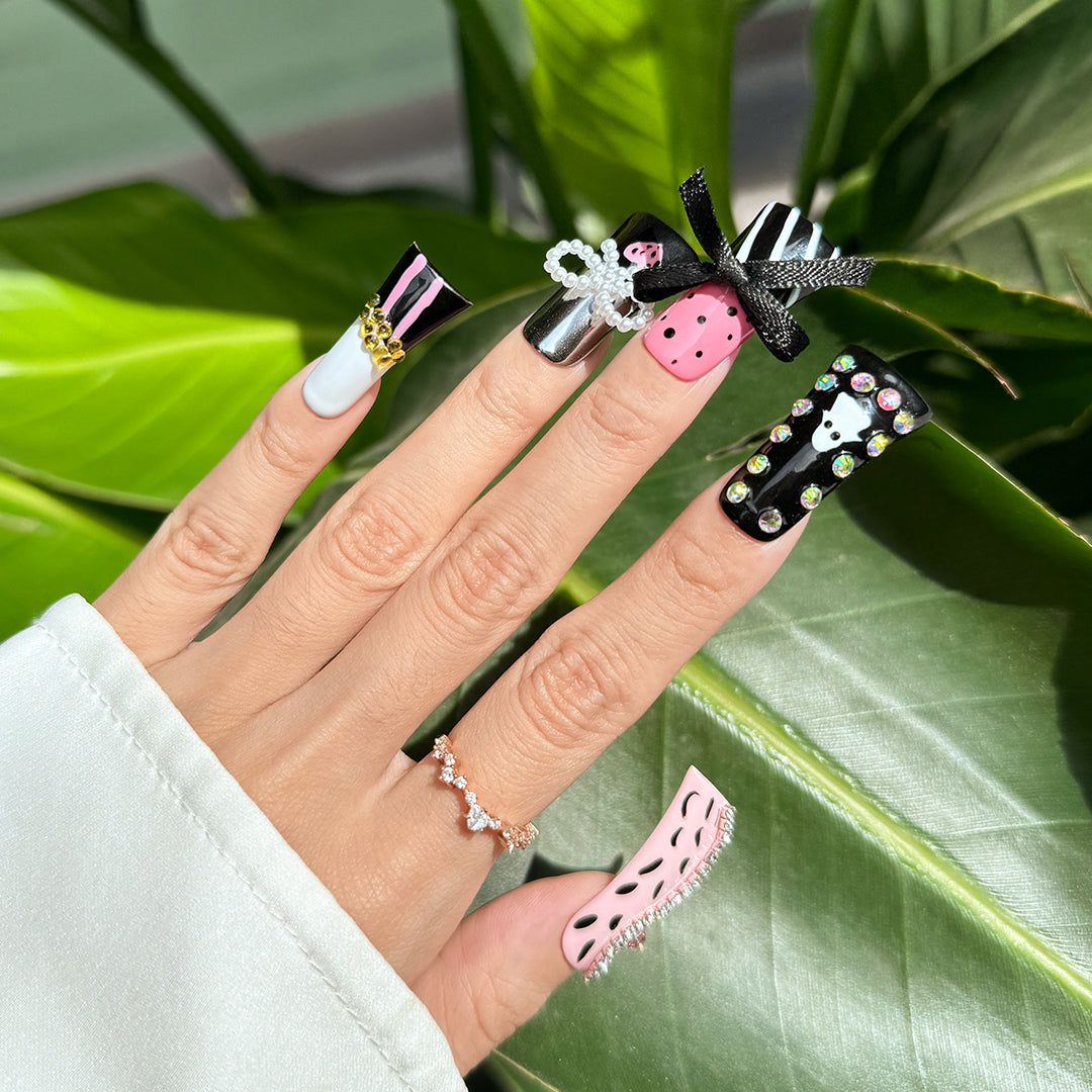 Fierce Sugar handmade duck-bill press-on nails in black and pink with leopard print, ghost art, rhinestones, and bows