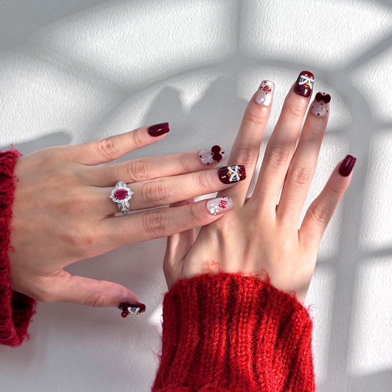 Close-up of Lion Fortune handmade short square press-on nails featuring lion dance designs and ‘财’ symbol, symbolizing good fortune and prosperity for Chinese New Year.