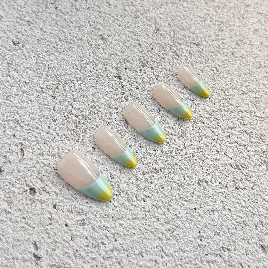 Fincloset almond-shaped sheer French press-on nails with mint green to yellow gradient tips, fresh and minimalist design.