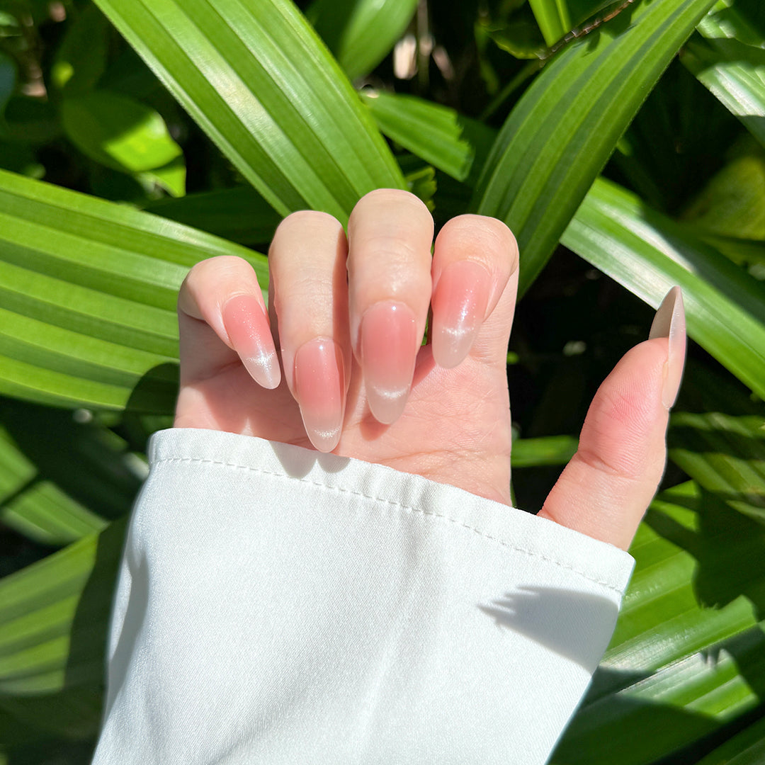 Fincloset handmade almond-shaped press-on nails in smoky rose with glossy cat-eye French tips, perfect for elegant dates and parties.