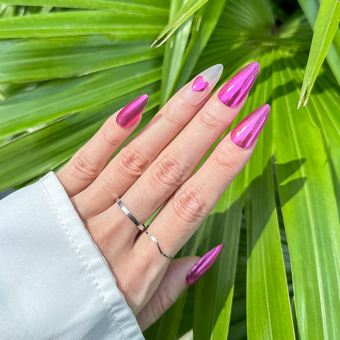 Handmade almond-shaped press-on nails in metallic rose red with milky white accents and a bold heart design. Daring, sexy, and fiery style.