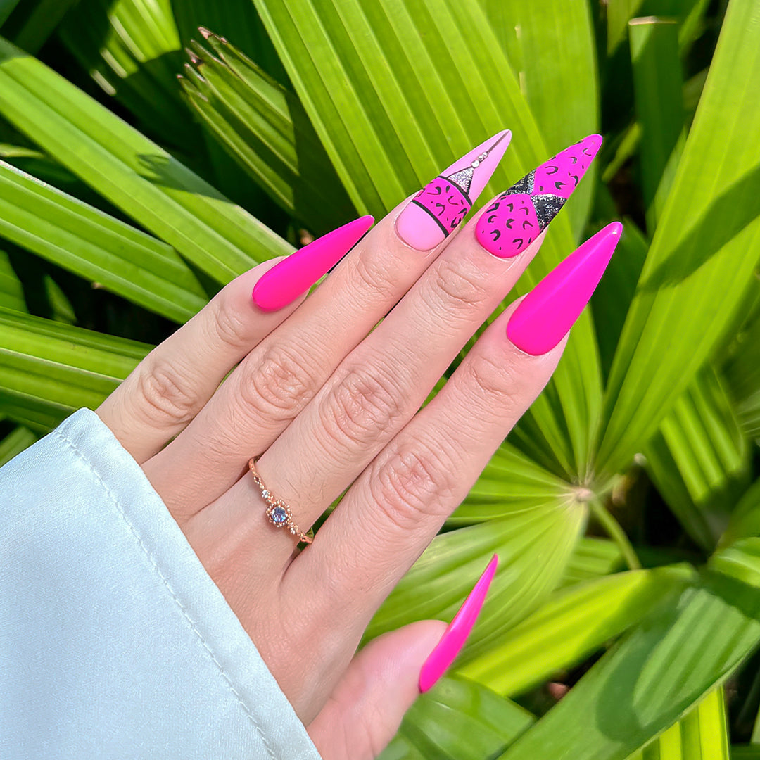 Handmade stiletto-shaped press-on nails in matte and glossy rose pink with bold cheetah print design.