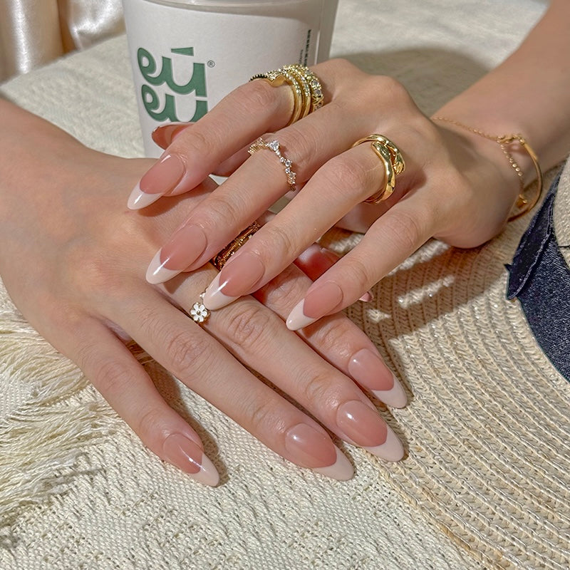 Fincloset French tip almond press-on nails featuring a natural pink base, perfect for everyday wear, handcrafted for a seamless look.
